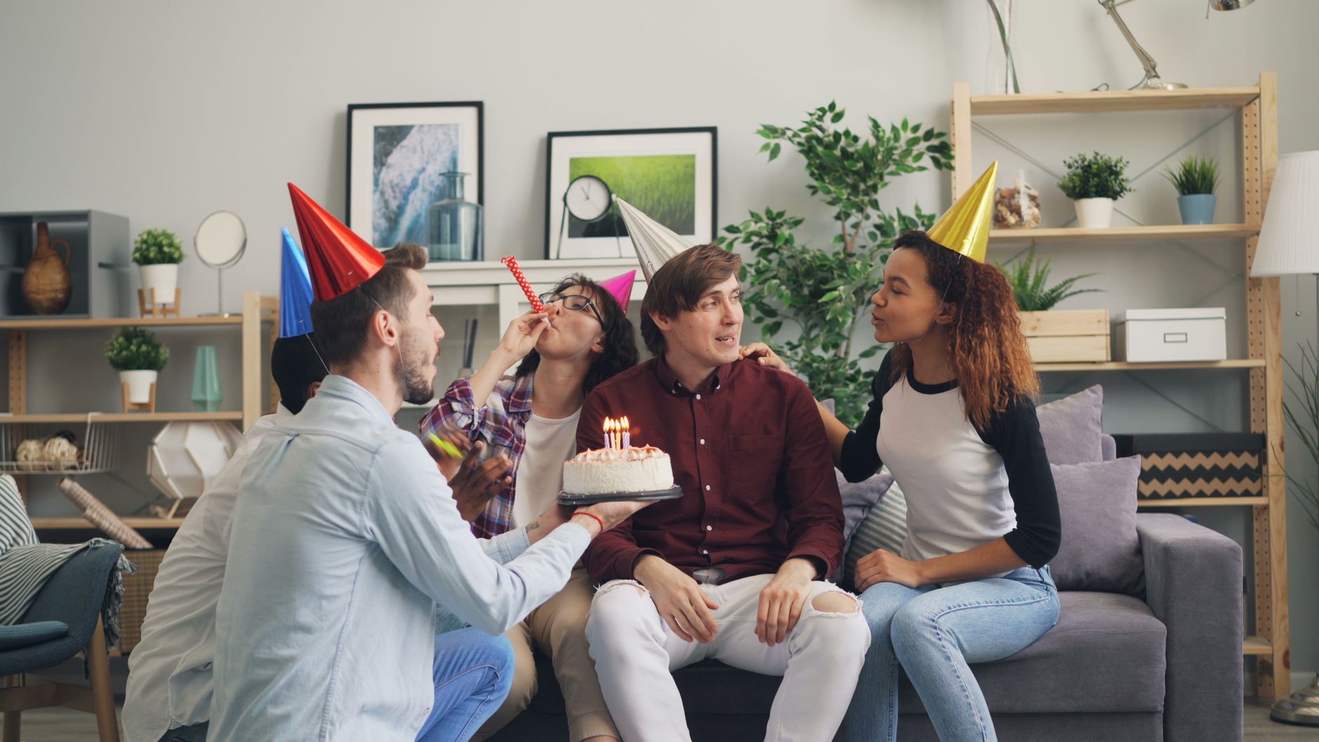 group of friends celebrating birthday at home