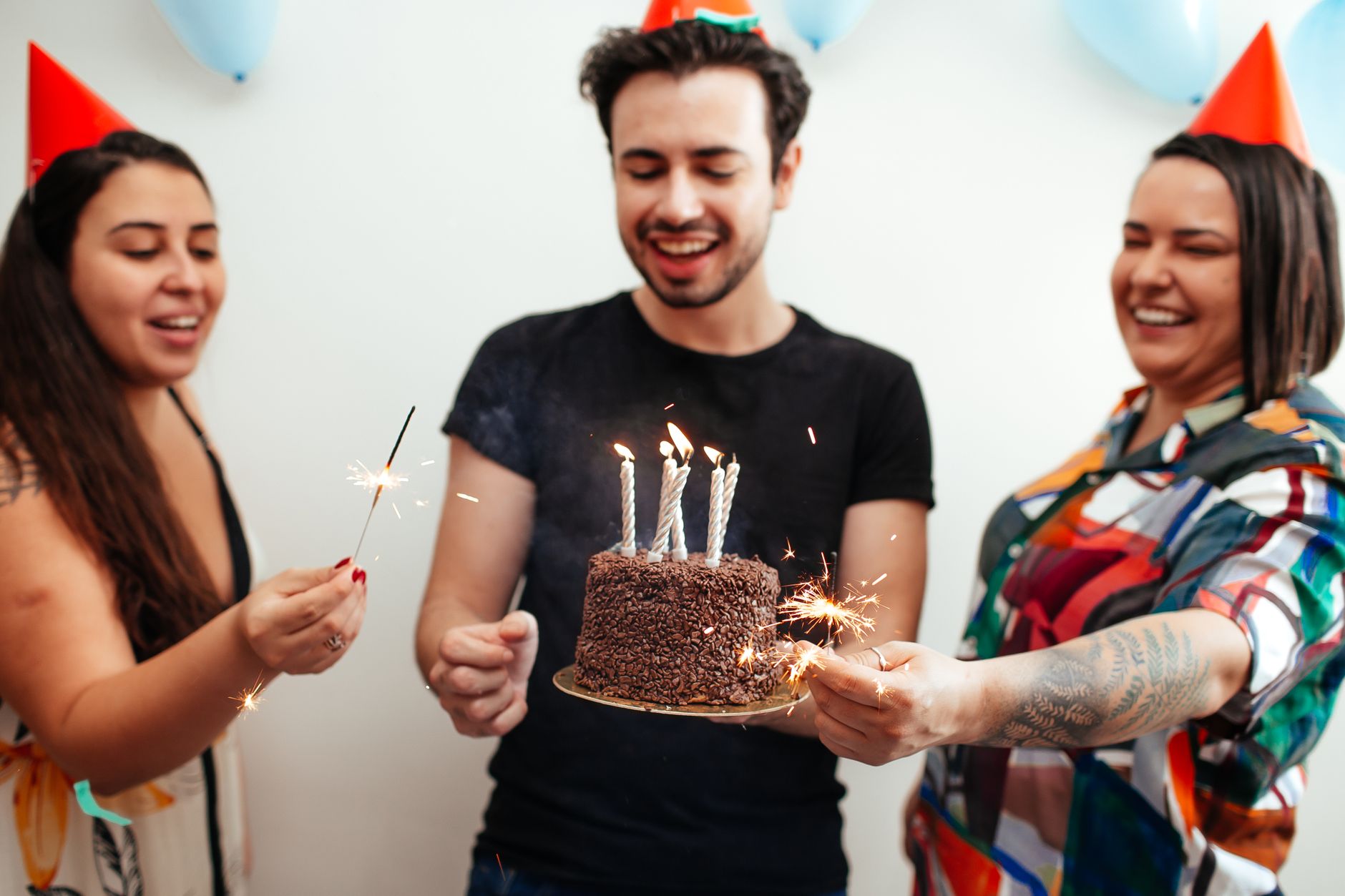 friends with birthday cake
