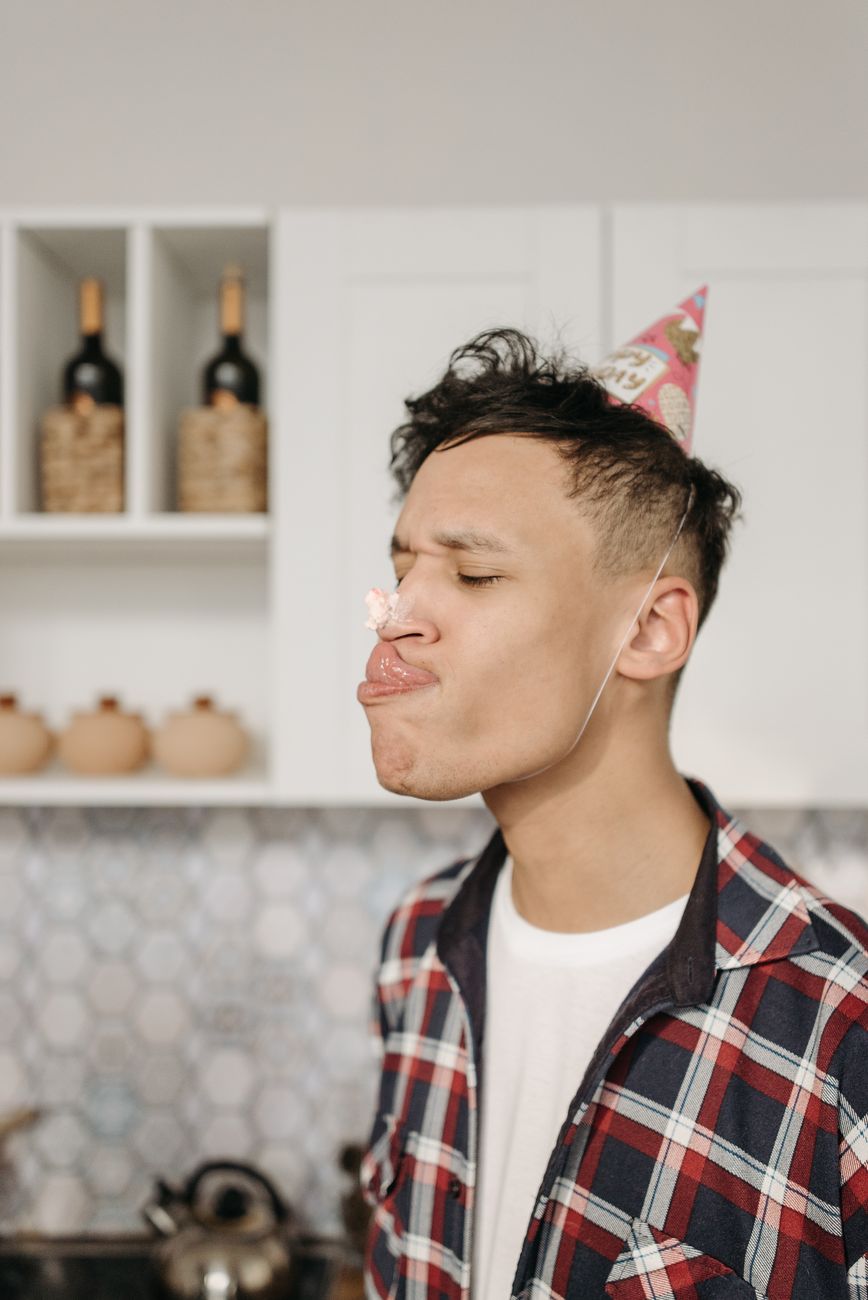a man wearing a party hat