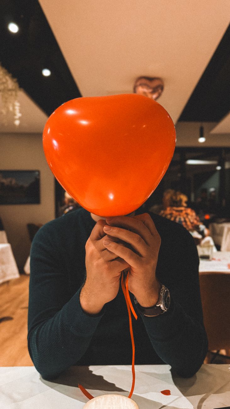 heart shaped balloon in a restaurant setting